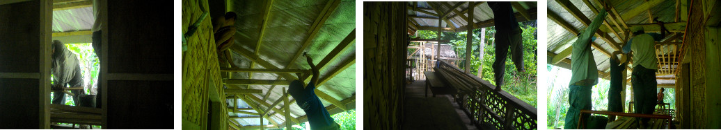 Images of workmenn rebuilding tropical house roof