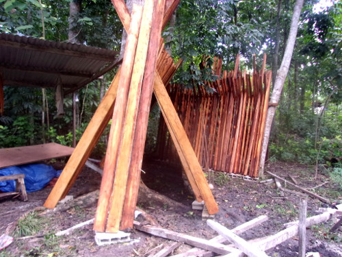 Image of wood for construction of new
        pig pens