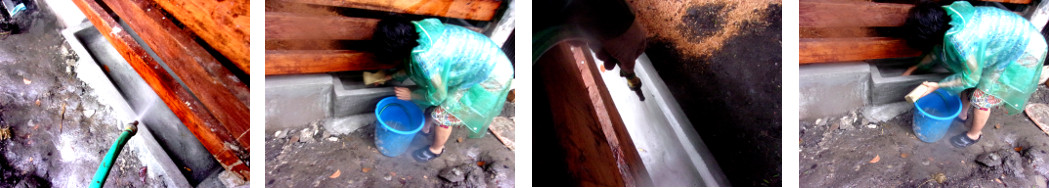 Images of new concrete troughs being washed before use
        by pig