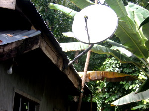 Image of tropical house with Satelite antenae