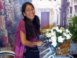 Image of woman with decorative bicycle