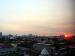 Image of sunrise over Quezin City